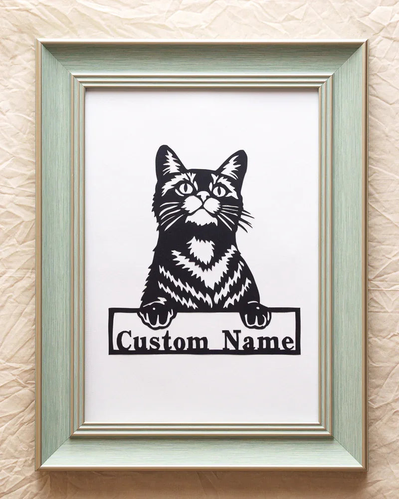 This is an original Papercut with cat‘ name, an art form in which an entire image is hand-cut from a single sheet of paper.