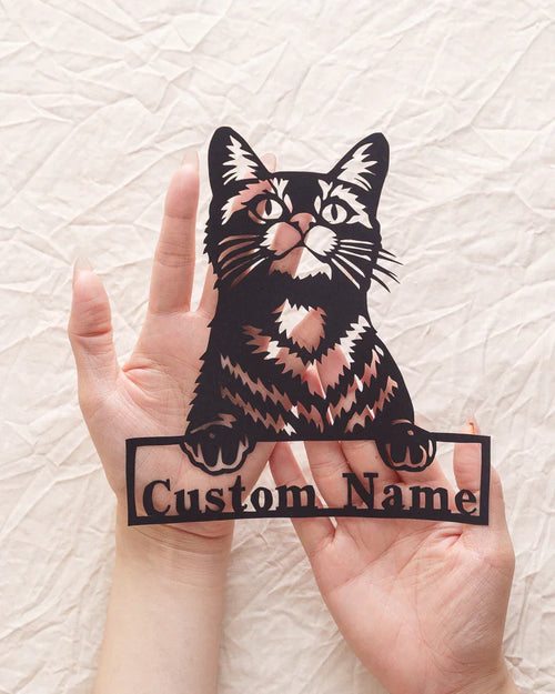 Custom paper-cut artwork featuring your beloved cat's portrait and name, held on hand​