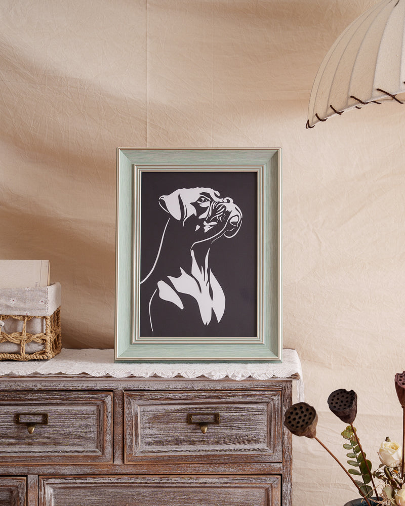 His framed paper spirit now guards the fireplace mantel — forever standing watch where sunbeams warm his spot daily 