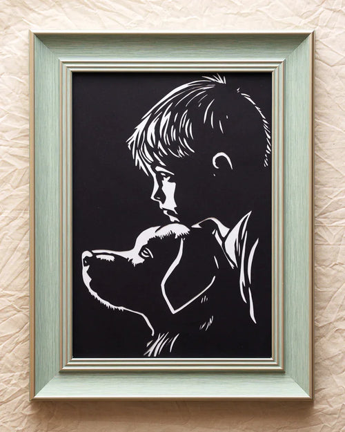 Child nestled on dog—hand-cut art capturing pure affection. Warm memory in paper for home
