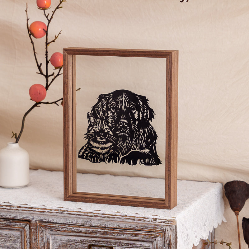 A cat and dog papercut artwork displayed at home, adding warmth and emotional remembrance to the living space