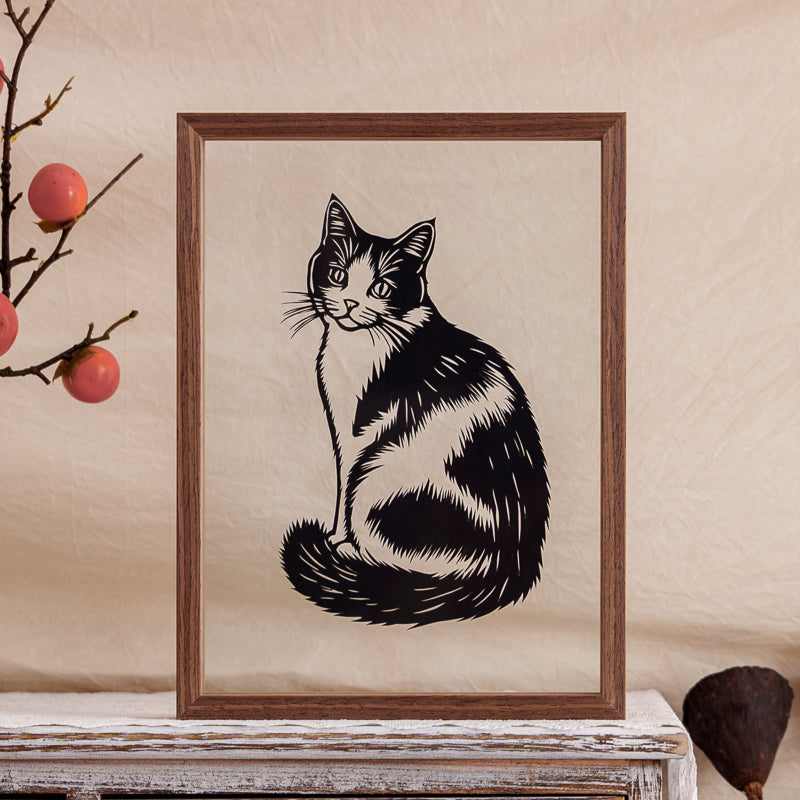 A handcrafted papercut artwork of a cow-pattern cat, capturing its unique markings and gentle expression in fine detail