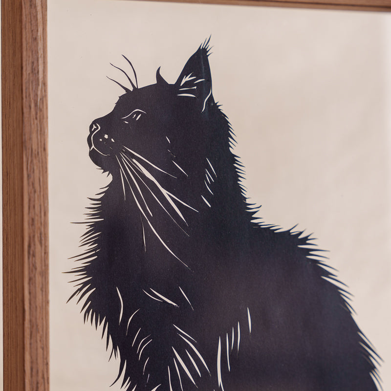 Close-up detail of a handmade cat papercut memorial, showcasing fine carving techniques that carefully capture the cat’s fur and unique features.