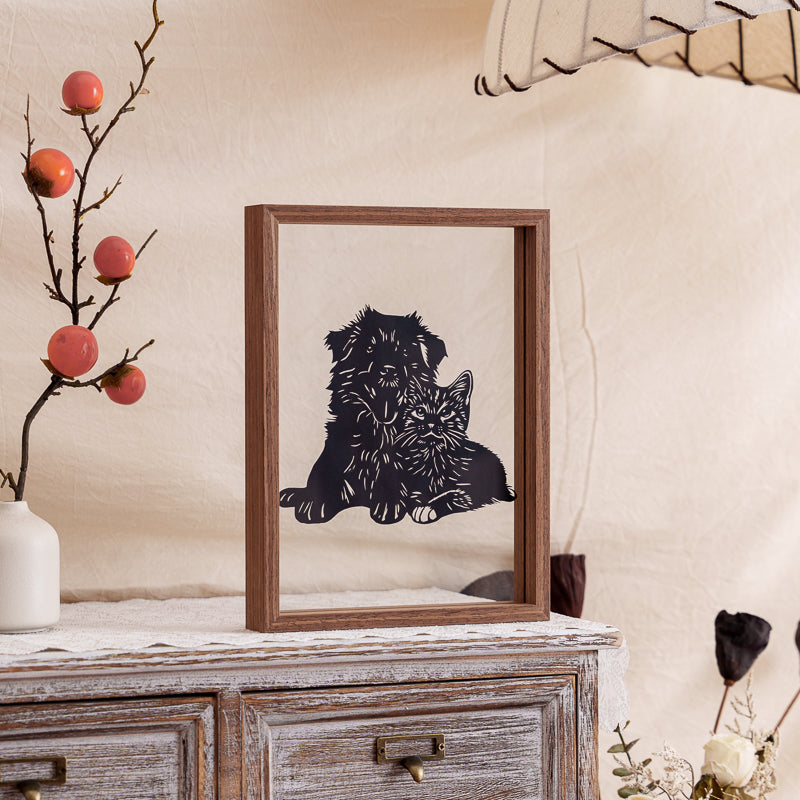 A dog and cat papercut artwork displayed at home, serving as a heartfelt decoration that keeps their memory close