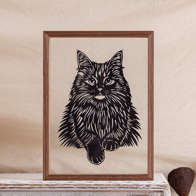 Elegant Maine Coon cat papercut artwork, a handmade memorial piece showing the cat sitting gracefully from the front view.