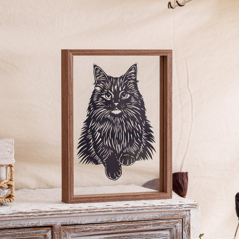 Fluffy Maine Coon cat silhouette memorial, beautifully framed in a transparent glass frame, highlighting the cat’s noble presence.