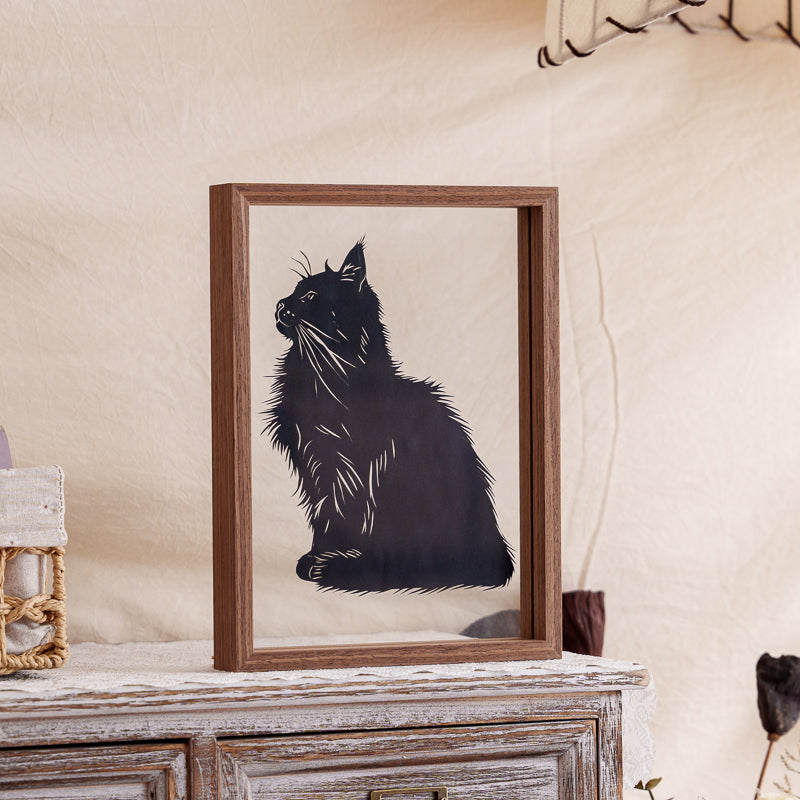 Cat papercut memorial artwork beautifully framed in a transparent glass frame, serving as a handmade keepsake to commemorate a departed cat.
