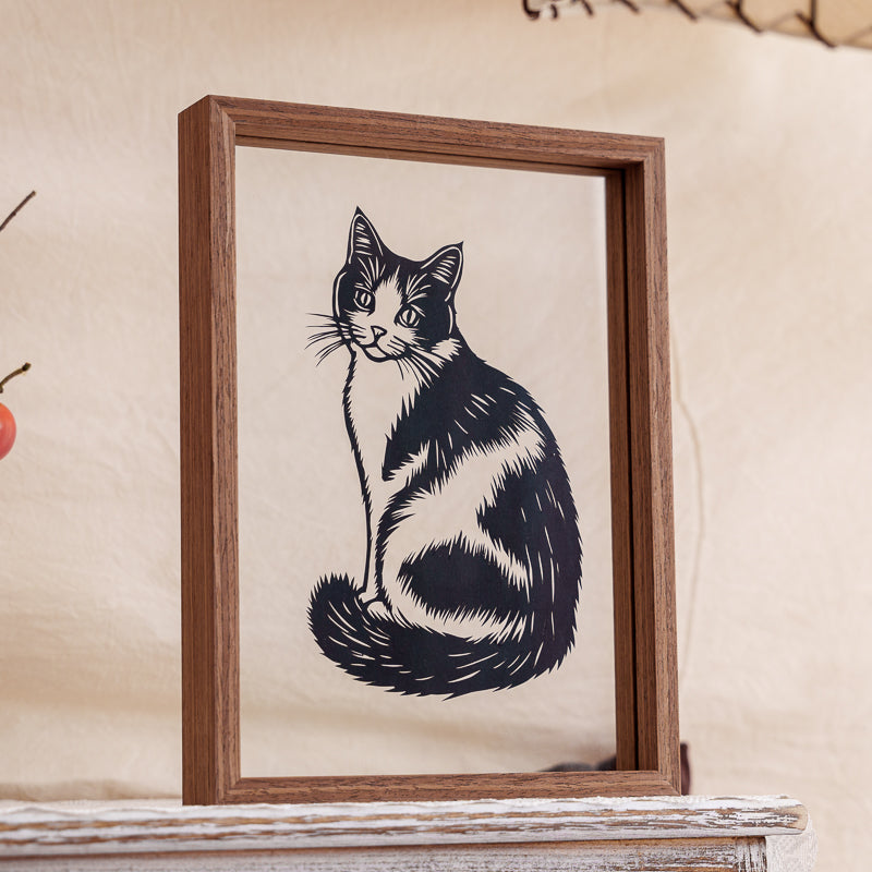 A finely handcrafted cat papercut artwork, showcasing detailed carving and the gentle spirit of a cherished pet