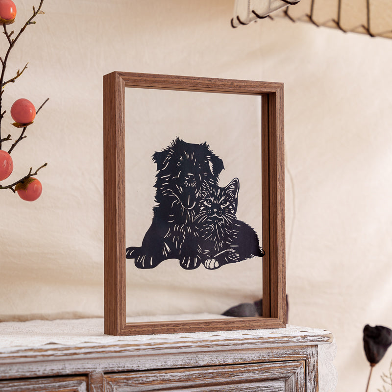 A detailed view of a handcrafted pet papercut, showing fine carving lines and the precision of artisan craftsmanship