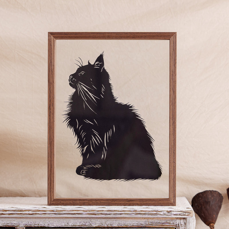Handmade papercut memorial artwork of a noble cat sitting gracefully, an elegant silhouette designed to honor and remember a beloved pet.