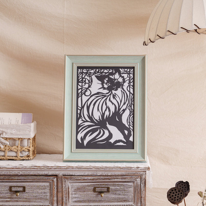 Framed handmade cat paper cut featuring elegant lines and symbolic motifs, perfect as a pet memorial.