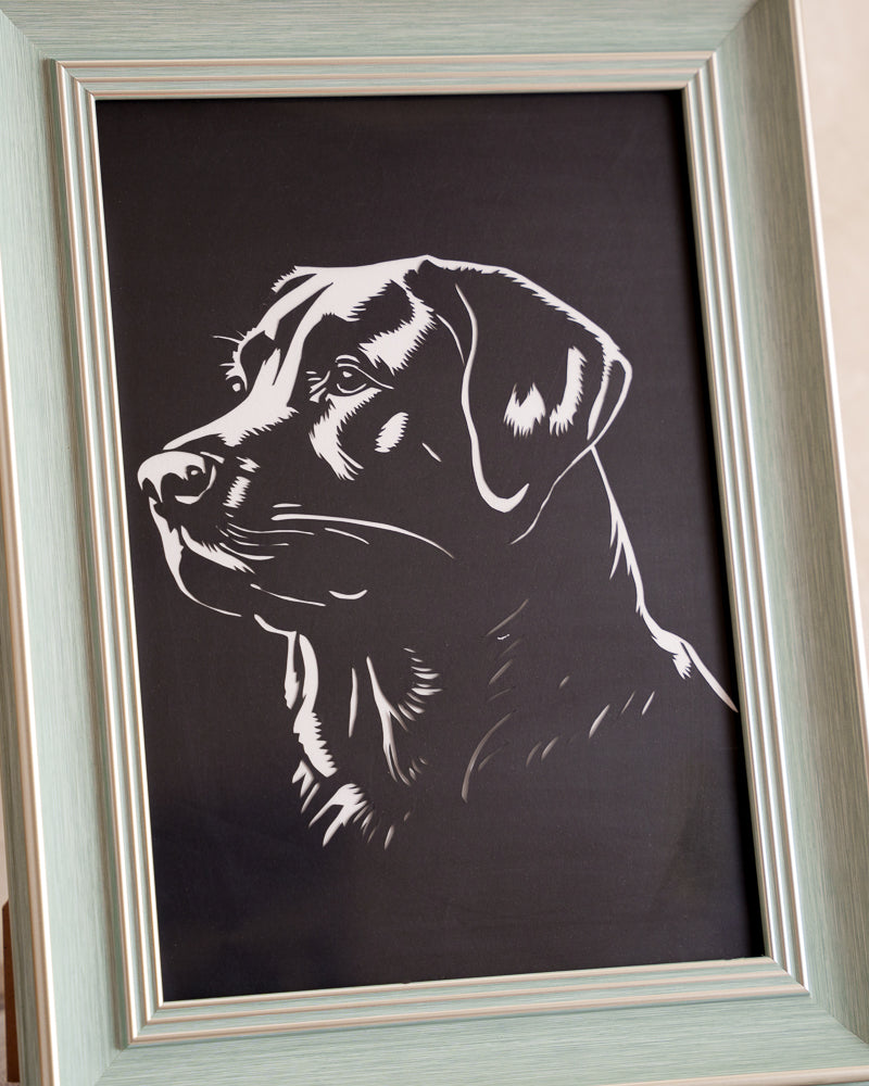 Pet memorial paper-cut decor piece in living space
