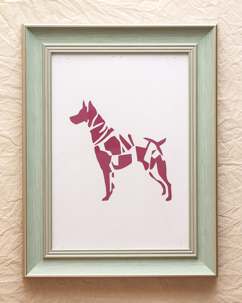 An abstract paper artwork depicting a dog's full body in a unique side profile silhouette style