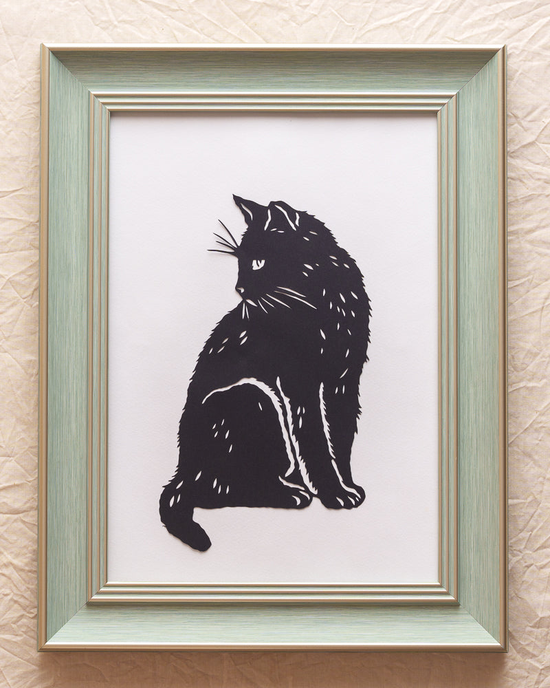 Hand-cut silhouette of a cat created as a pet memorial artwork