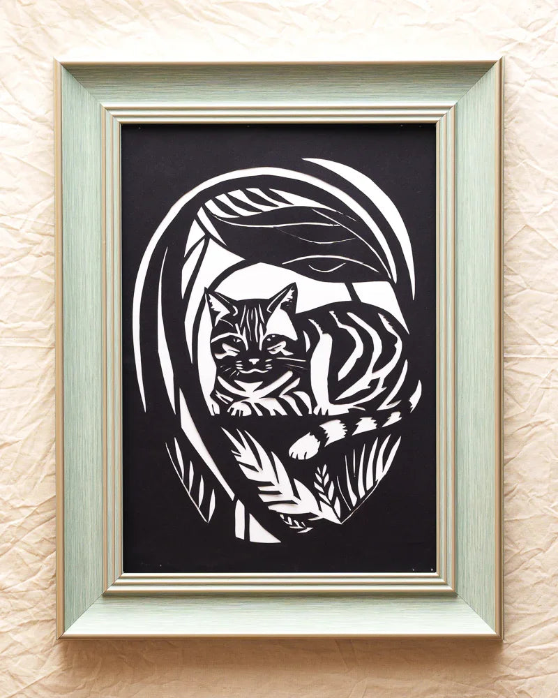 This paper-cut cat in the garden captures a beautiful memory
