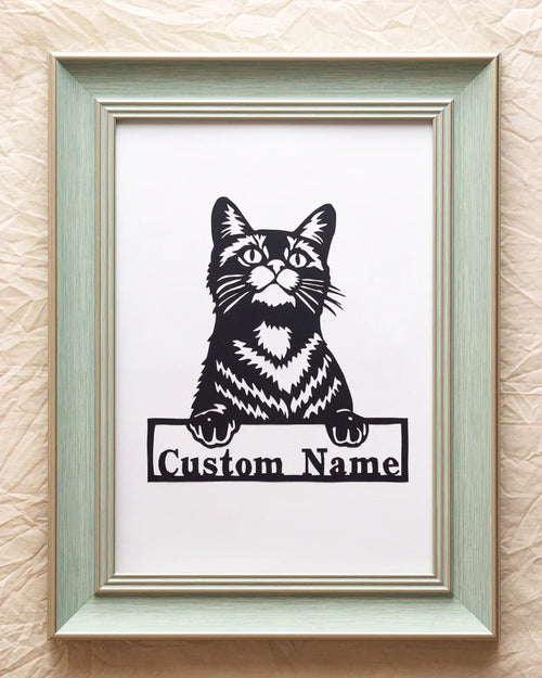 This is an original Papercut with cat‘ name, an art form in which an entire image is hand-cut from a single sheet of paper.