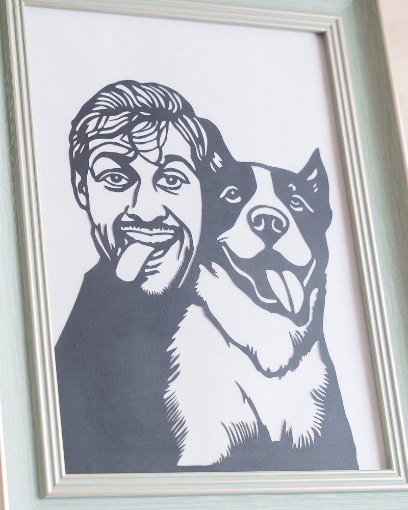Macro shot of hand-cut paper details showing individual fur strands in dog portrait