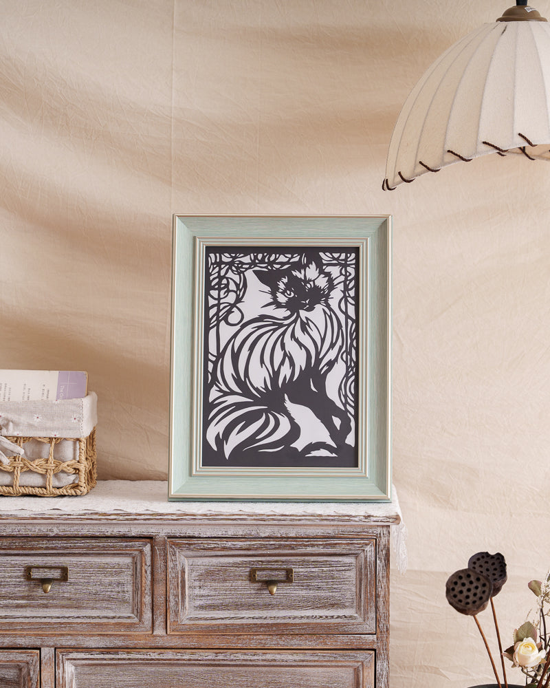 Framed handmade cat paper cut featuring elegant lines and symbolic motifs, perfect as a pet memorial.