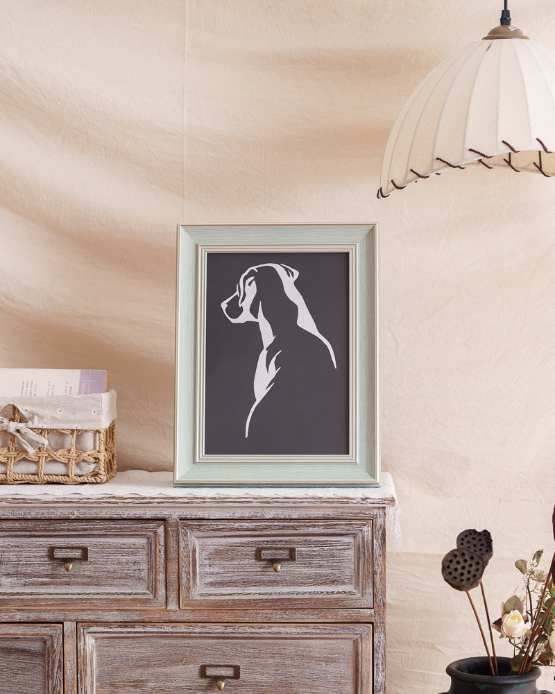 Framed Labrador paper cut art displayed as home decor

