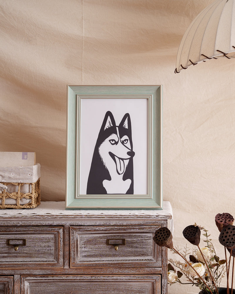 Wooden display shelf showcasing framed husky silhouette paper art in minimalist home