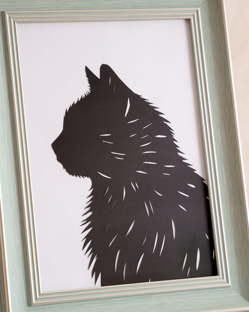 A touching paper cut artwork depicting a cat's spirit, designed as a personalized memorial