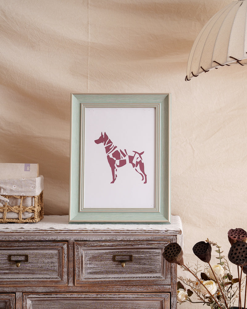Framed dog silhouette or paper artwork displayed as meaningful home decoration