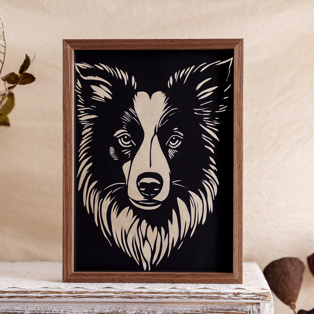 A striking silhouette papercut capturing the sleek posture and detailed fur texture of a Border Collie — a perfect tribute to this intelligent and energetic breed.