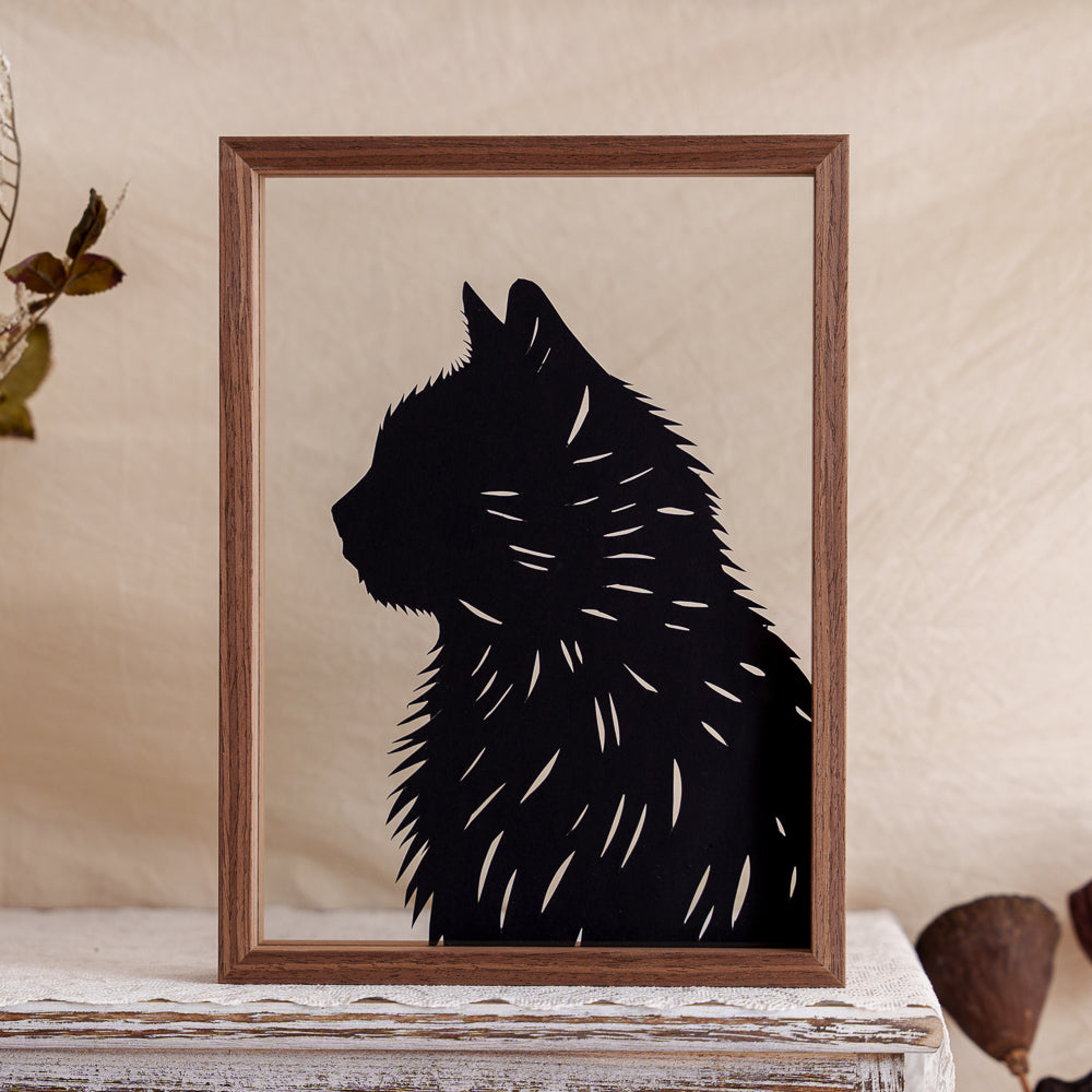 A minimalist papercut silhouette capturing the side profile of a fluffy cat, gently accented with subtle fur details.