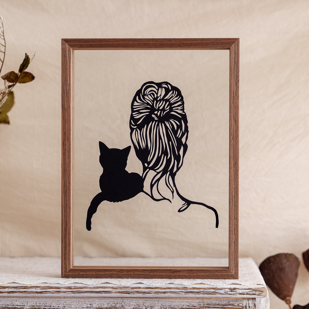 A memorial papercut artwork showing the backview of a cat perched on its owner's shoulder — a quiet moment of closeness and trust.