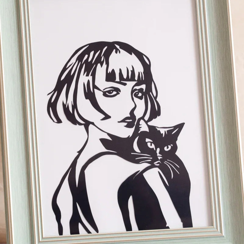 A detailed close-up view of a cat memorial papercut, showcasing the fine lines and delicate craftsmanship of the artwork.