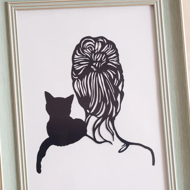 Masterful scalpel-cut openwork reveals exquisitely carved hair filaments, showcasing the cat resting on its owner's shoulder—a testament to the artist's precision and the gentle bond of companionship etched in paper