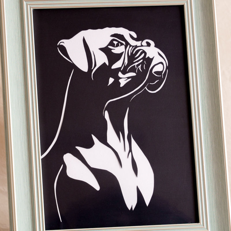 Look closely to see the bulldog's handsome expression perfectly captured in this paper-cut