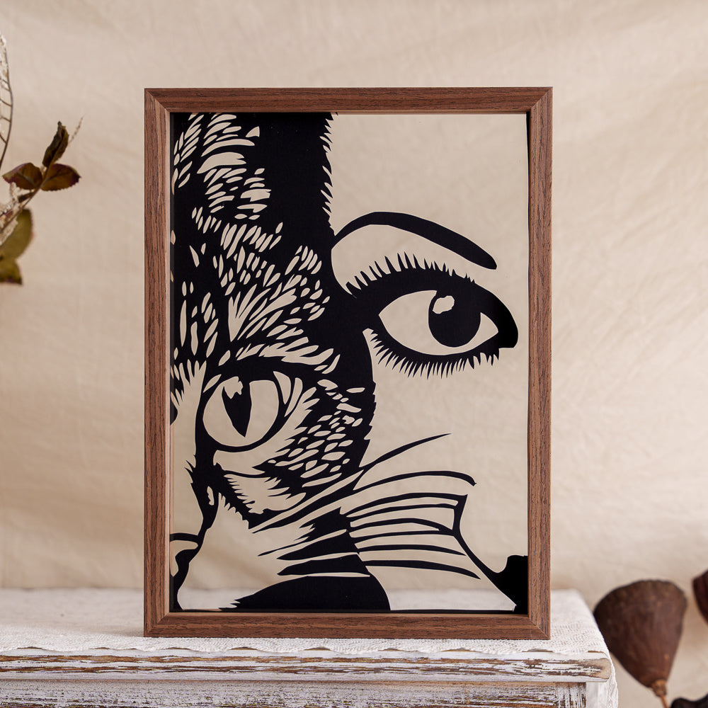 A heartwarming papercut memorial capturing the tender moment of an owner and their cat leaning close together in a loving silhouette.