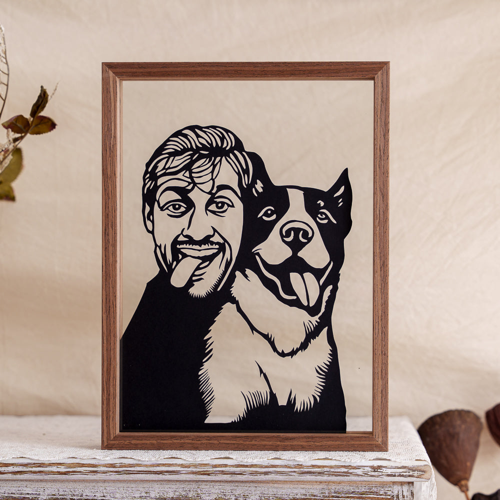 A heartfelt papercut artwork showing the owner hugging their dog, heads touching, playfully mimicking the dog’s tongue-out expression.