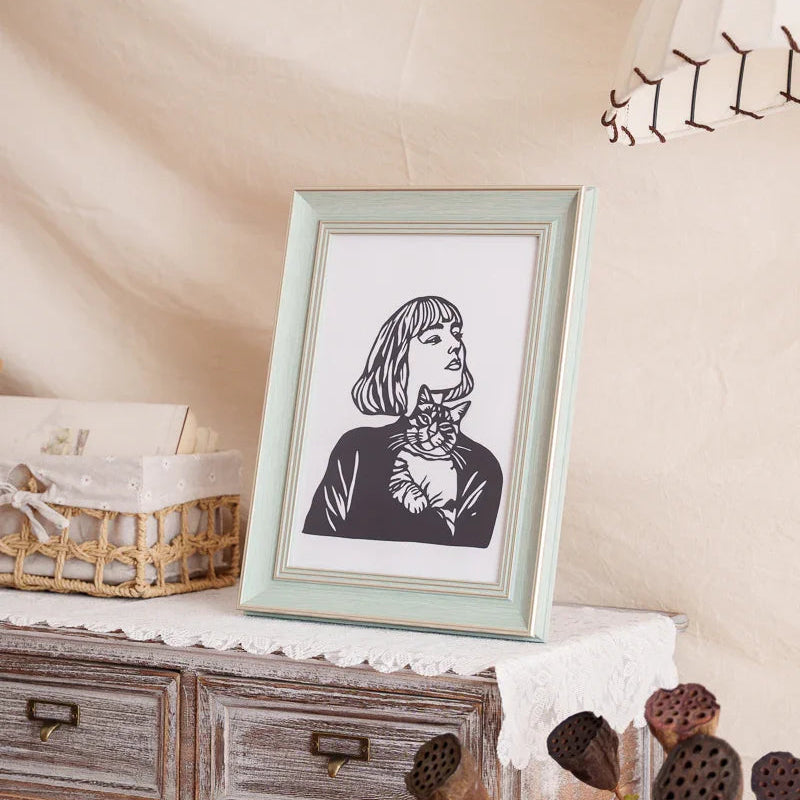 View this paper cut from the side—the owner and her cat come alive with amazing depth!​