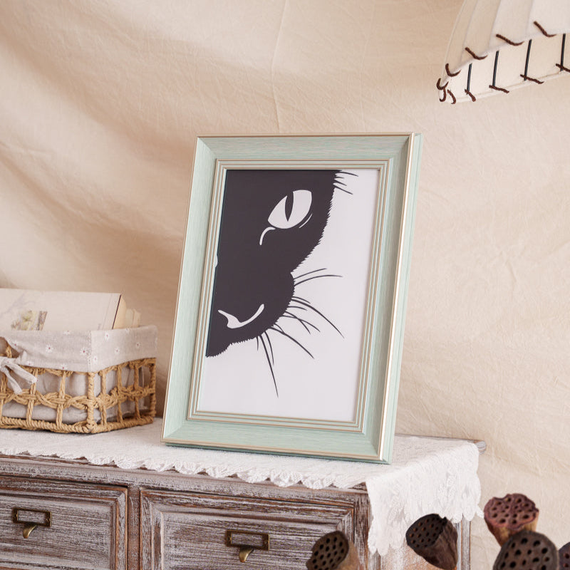 Framed cat paper cut memorial displayed at home as a decorative piece