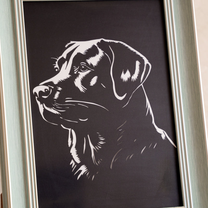 Pet memorial paper-cut decor piece in living space
