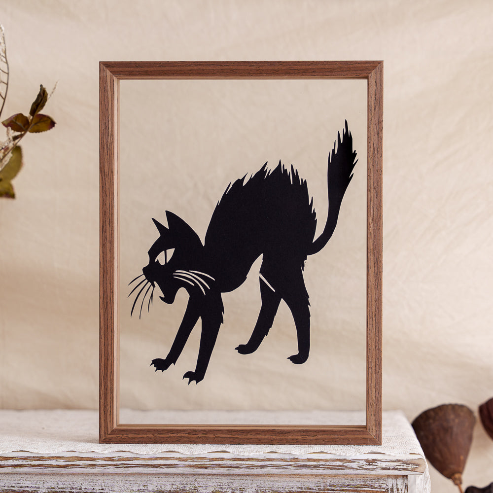 A memorial papercut capturing the hilarious moment a cat gets startled — fur fluffed up, tail puffed, and full of dramatic flair.