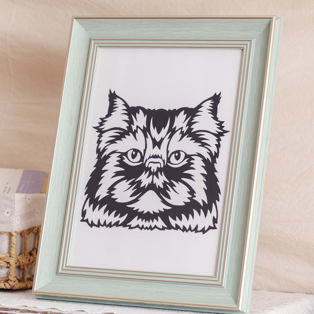 Detailed black cat silhouette paper cut with visible fine carving marks