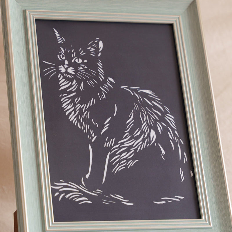 Cat paper cut showing intricate fur detail with hand-cut precision

