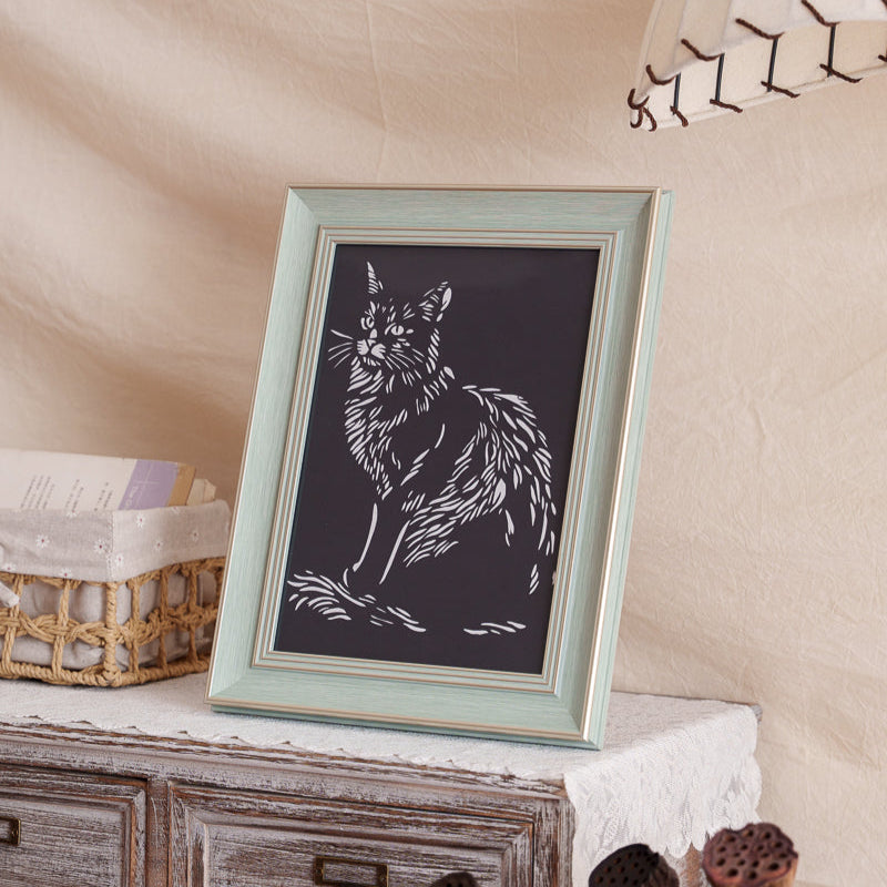 Pet cat silhouette paper cut memorial displayed at home