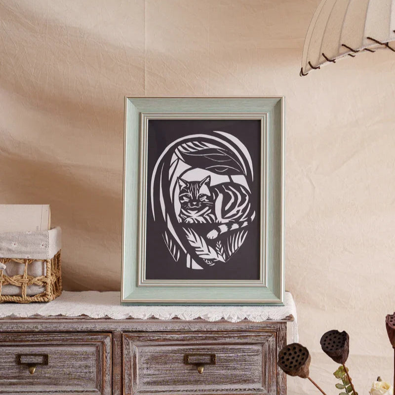 To honor my kitty, this paper-cut of her now sits at home