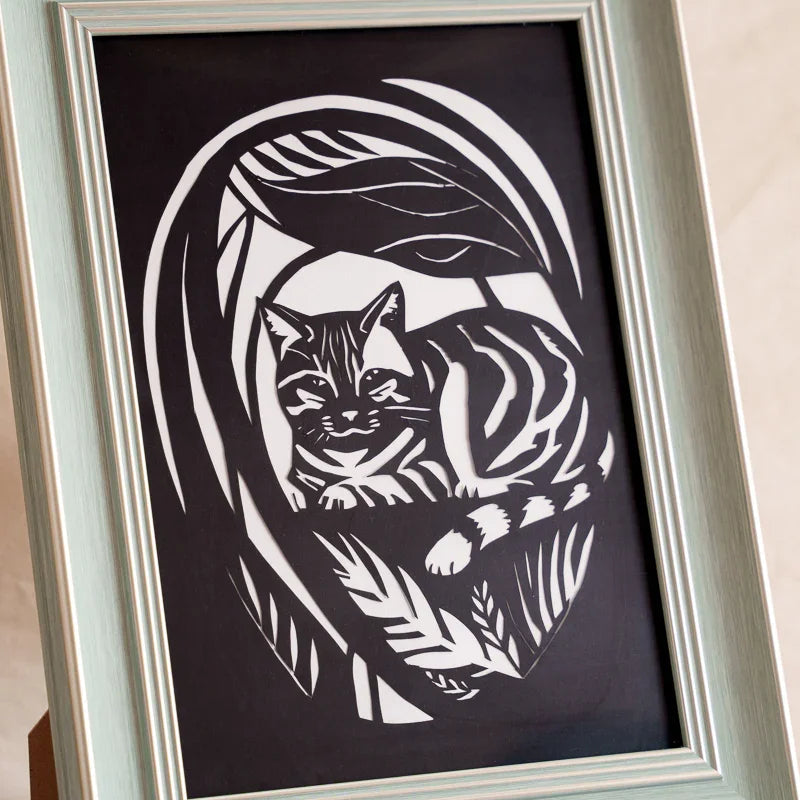 Getting close to see every detail of my cat's paper-cut art
