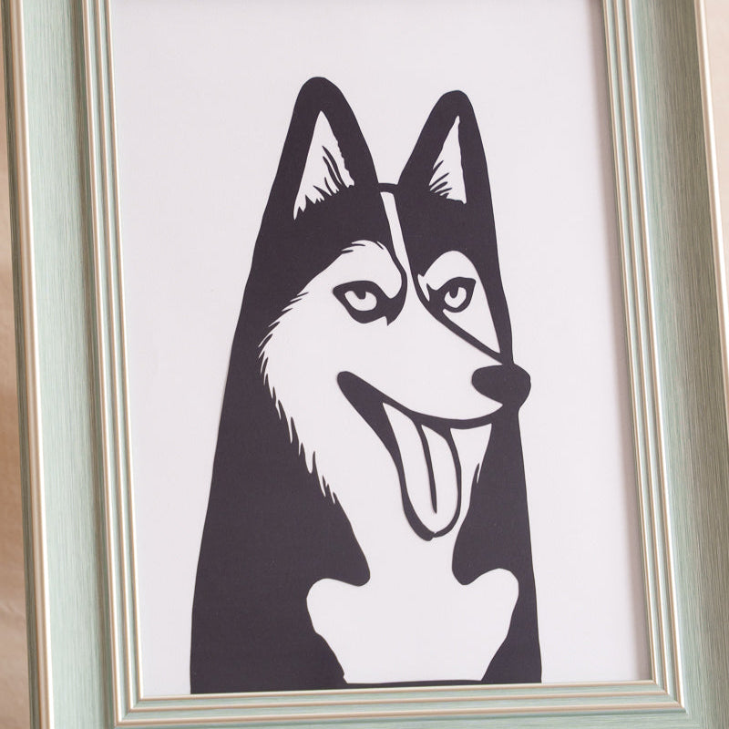 Closeup of hand-cut details showing husky's fur direction and ear contours on paper edge