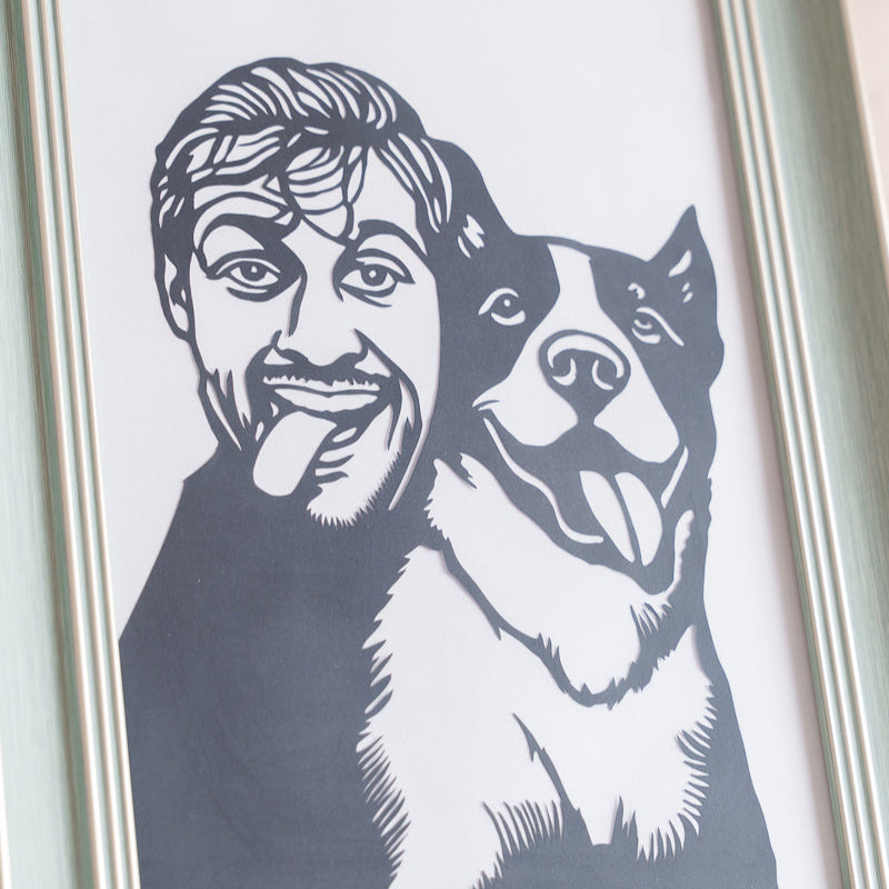 Macro shot of hand-cut paper details showing individual fur strands in dog portrait