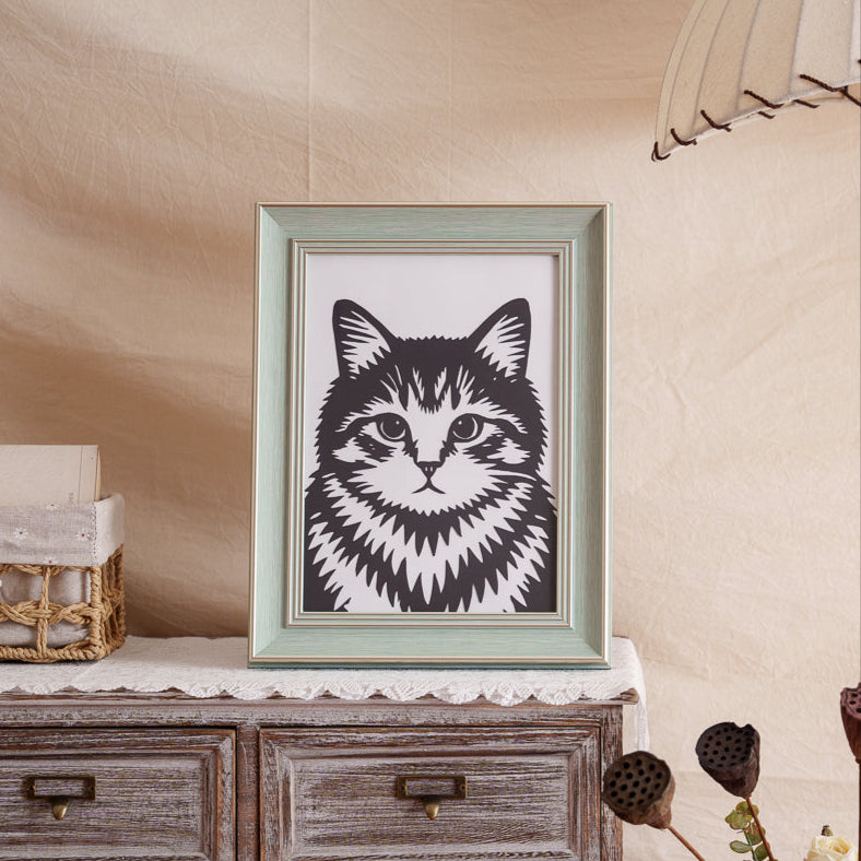 A carefully crafted cat paper-cut artwork placed on a shelf or wall, adding a personalized touch to home decor