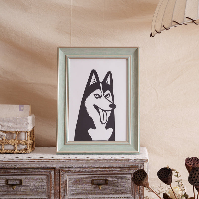 Wooden display shelf showcasing framed husky silhouette paper art in minimalist home